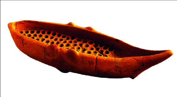 Minoan ceramic model of a boat transporting honey combs